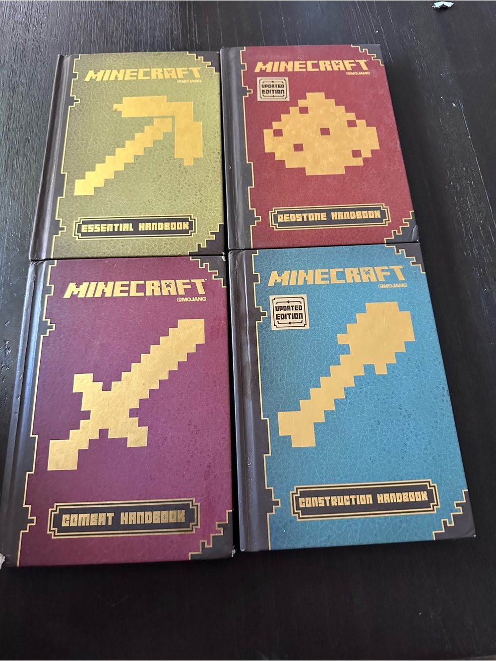 Scholastic Minecraft Handbooks - Gold, Green, Red, Burgundy & Blue Covers